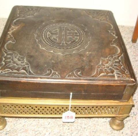 Hand carved Lidded Asian Box on Pierced Brass Stan: Hand carved Lidded Asian Box on Pierced Brass Stand: Shallow Hand carved Wooden Box with Metal Corners. Asian Medallion in Center with Bats at 4 Corners. 11 1/2" Square, 2 1/2"T. Footed Stand with Pie