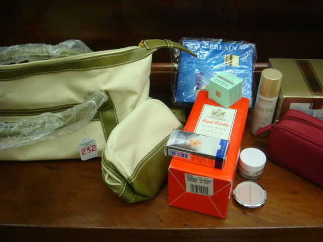 New in Boxes ESTEE LAUDER Purse with Cosmetics: New in Boxes ESTEE LAUDER Purse with Cosmetics: Guerlain Aqua Care, Nexus Mist, Orlane Tanner, Darphin Eye Cream, Royal Brierly Handmade Crystal Perfumer, Chante Caille Makeup Bag. (100-200)