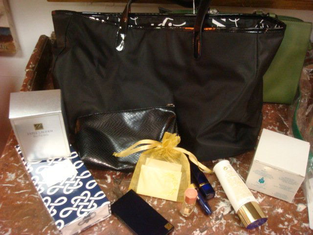 New in Boxes Black SAKS Tote, Green Purse, Cosmeti: New in Boxes Black SAKS Tote, Green Purse, Cosmetics: Estee Lauder Creams, Makeup and Perfume Pendant, LaCoste Belt, Brass Votive, Issima Cream. (100-200)