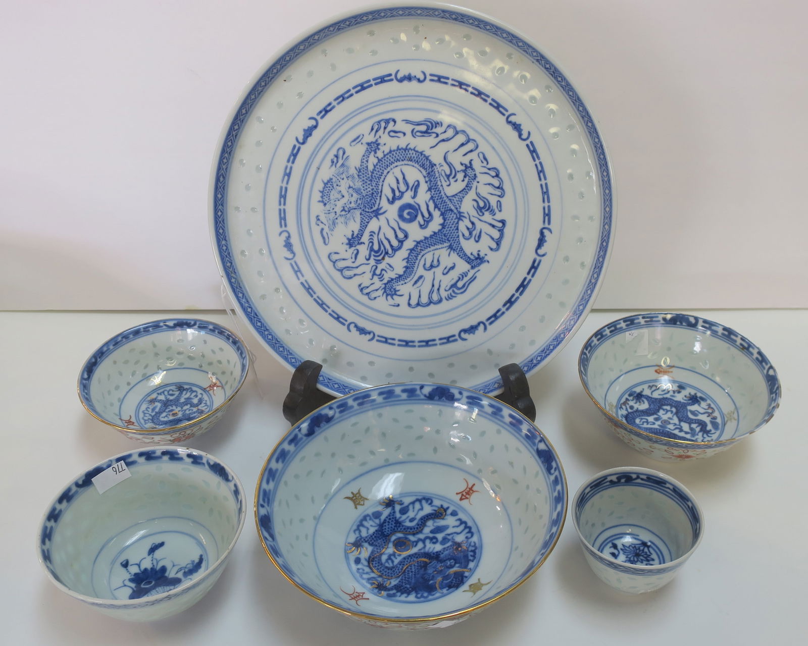 Six Jingdezhen Chinese Rice Pattern Blue/White China:: Six Jingdezhen Chinese Rice Pattern Blue/White China: 10 1/4" Round Platter and 3 Graduated Bowls with Dragon Center and Transparent Rice Grane Pattern. Two Other Bowls with Floral Centers. Bowls Meas