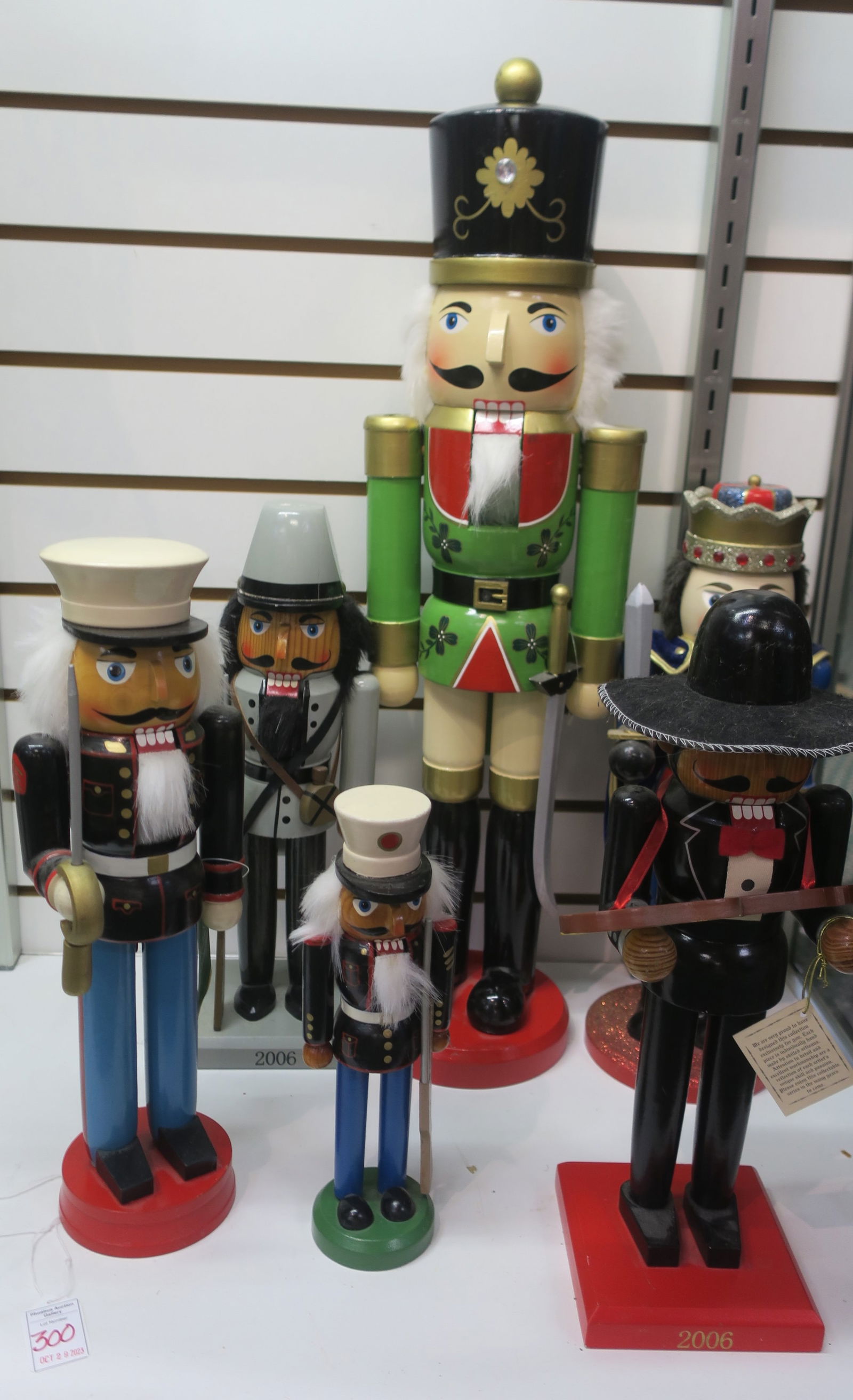 Six German Style Christmas Nutcrackers; 10"-24" Tall:: Six German Style Christmas Nutcrackers; 10"-24" Tall: Two Marine Corps Silent Drill Team, One with Sword, one with Rifle. Mexican Mariachi Guitar Player, Confederate Soldier with Rifle. Hussar with Bl