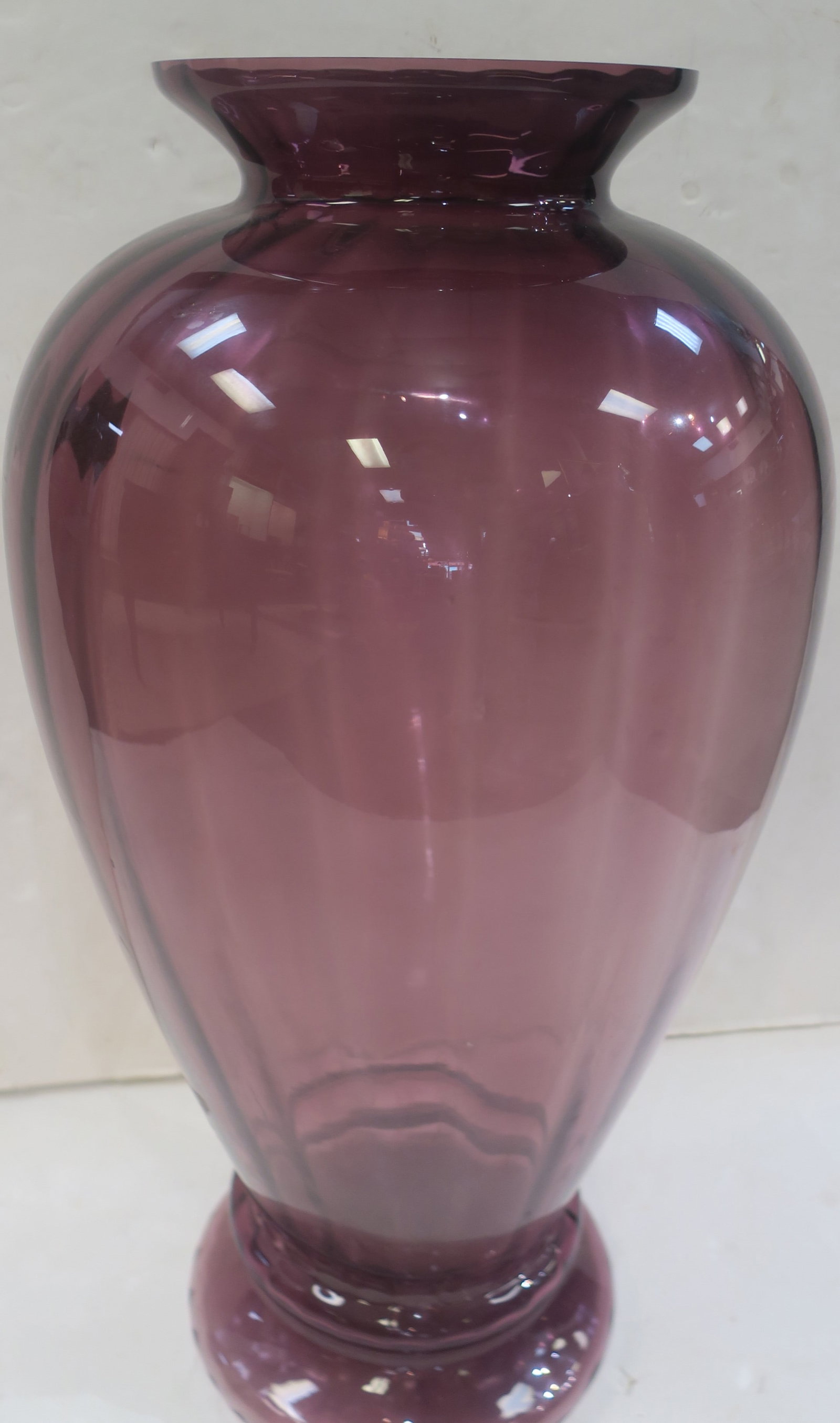 PILGRIM Glass Masterwork Coll. Amethyst Floor Vase:: PILGRIM Glass Masterwork Coll. Amethyst Floor Vase: Polished Rim with Flared Lip. Bulbous Tapered Body in an Optic Paneled Pattern. On a Double Stacked Round Foot. 28"T. Late 20th C, Mouth Blown, Made