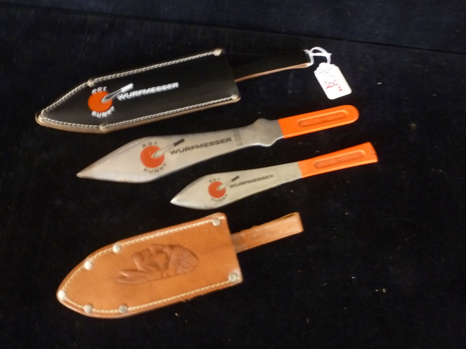 Pair of ROT PUNKT WURFMESSER Throwing Knives:: Pair of ROT PUNKT WURFMESSER Throwing Knives: Made in the Knife Capital of the World, Solingen Germany. One 11" and One 8" Throwing Knife, Both with Leather Sheaths with Belt Loops. Orange Painted Han