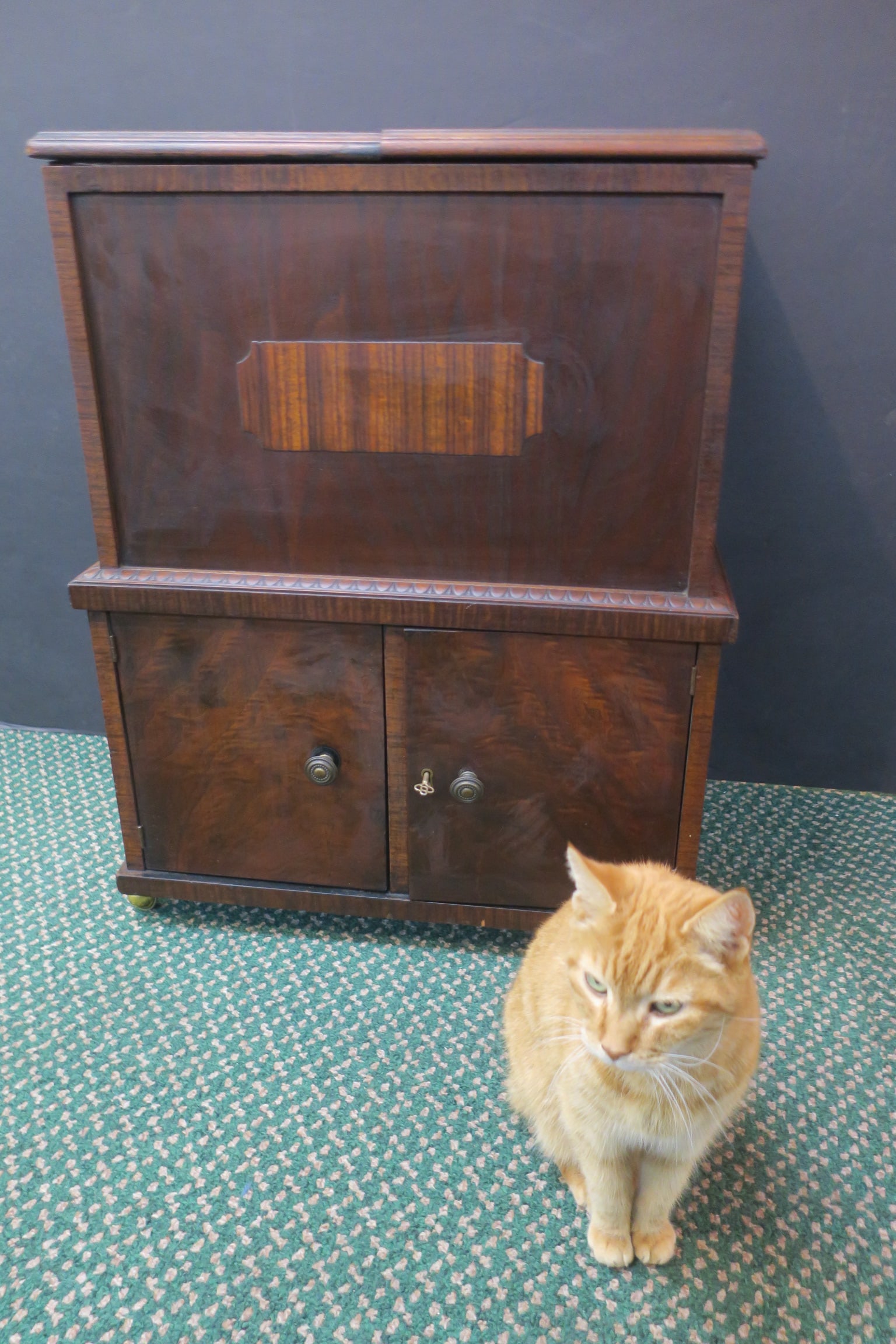 Mahogany Prohibition Era Pop Up Bar:: Mahogany Prohibition Era Pop Up Bar: Folding Double Hinged Top Liquor Shelf Pops Up. Over Double Door Cabinet for Storage with Key. Applied Rosewood Decor to Front of Cabinet with Key. On Wheels. 30"T