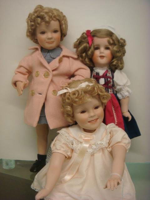 3 Limited Edition Porcelain Shirley Temple Dolls: 3 Limited Edition Porcelain Shirley Temple Dolls: Little Miss Marker, Teenas Dolls and Little Miss Shirley. Some From Danbury Mint, Handpainted and Ranging From Seated 11" to 18". (200-300)