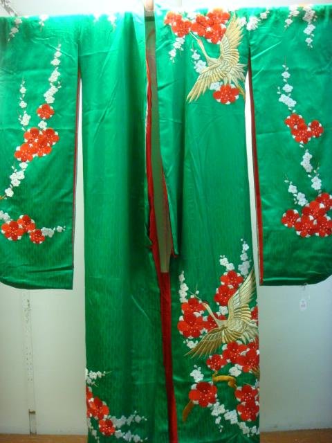 Emerald Green Japanese Brocade Furisode Kimono:: Emerald Green Japanese Brocade Furisode Kimono: Lined in Red Silk with Couched Embroidered Gold Flying Storks and Satin Stitched Floral. Made in 8 Pieces From Single Bolt of Fabric. Artistic Piece of 