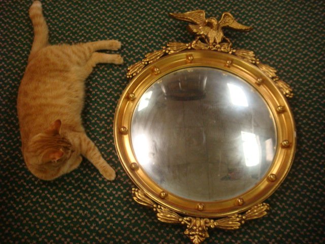 Regency Style Carved Giltwood Bull's-eye Mirror: Regency Style Carved Giltwood Bull's-eye Mirror: Round Convex Mirror with 13 Spheres (Some Gilt Rubbed), Surmounted by Spread Wing Eagle. 30"T X 21 1/4"Across. (200-300)