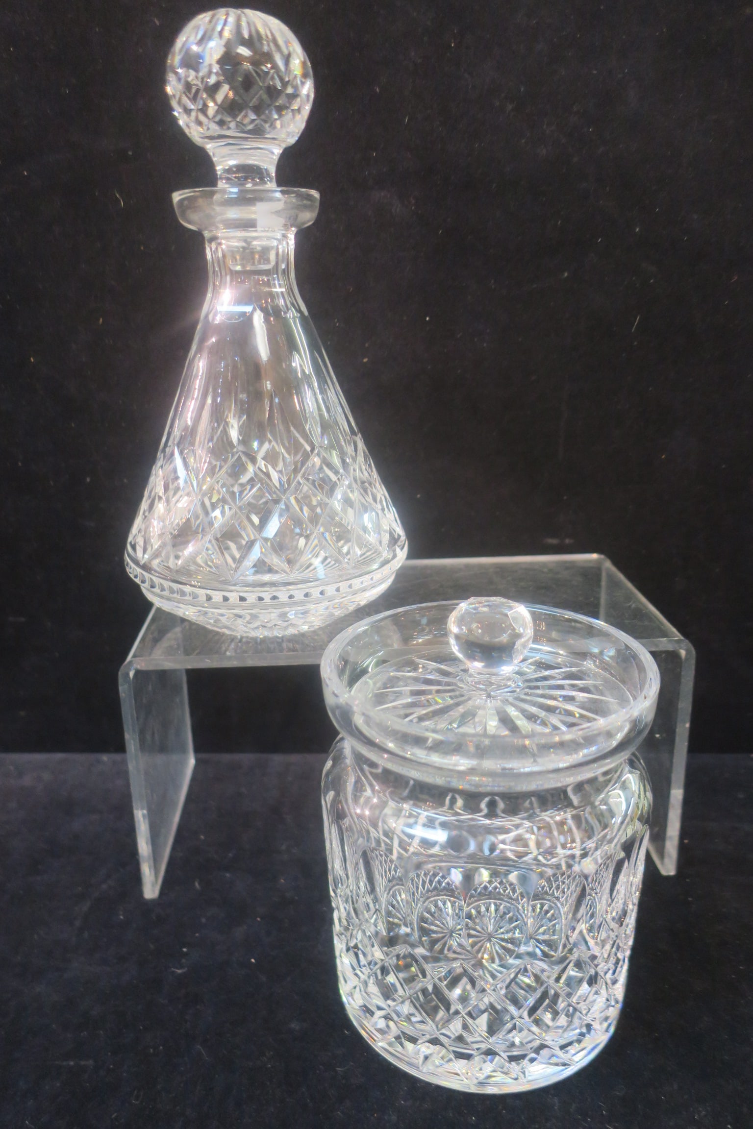 WATERFORD "LISMORE" Decanter & "COLLEEN" Biscuit Jar:: WATERFORD "LISMORE" Decanter & "COLLEEN" Biscuit Jar: Discontinued Waterford Piece with Panel Cut Knob on Lid, Excellent Condition 6 3/4" Tall, 5" Diameter. Lismore Roly-Poly Decanter with Stopper is 