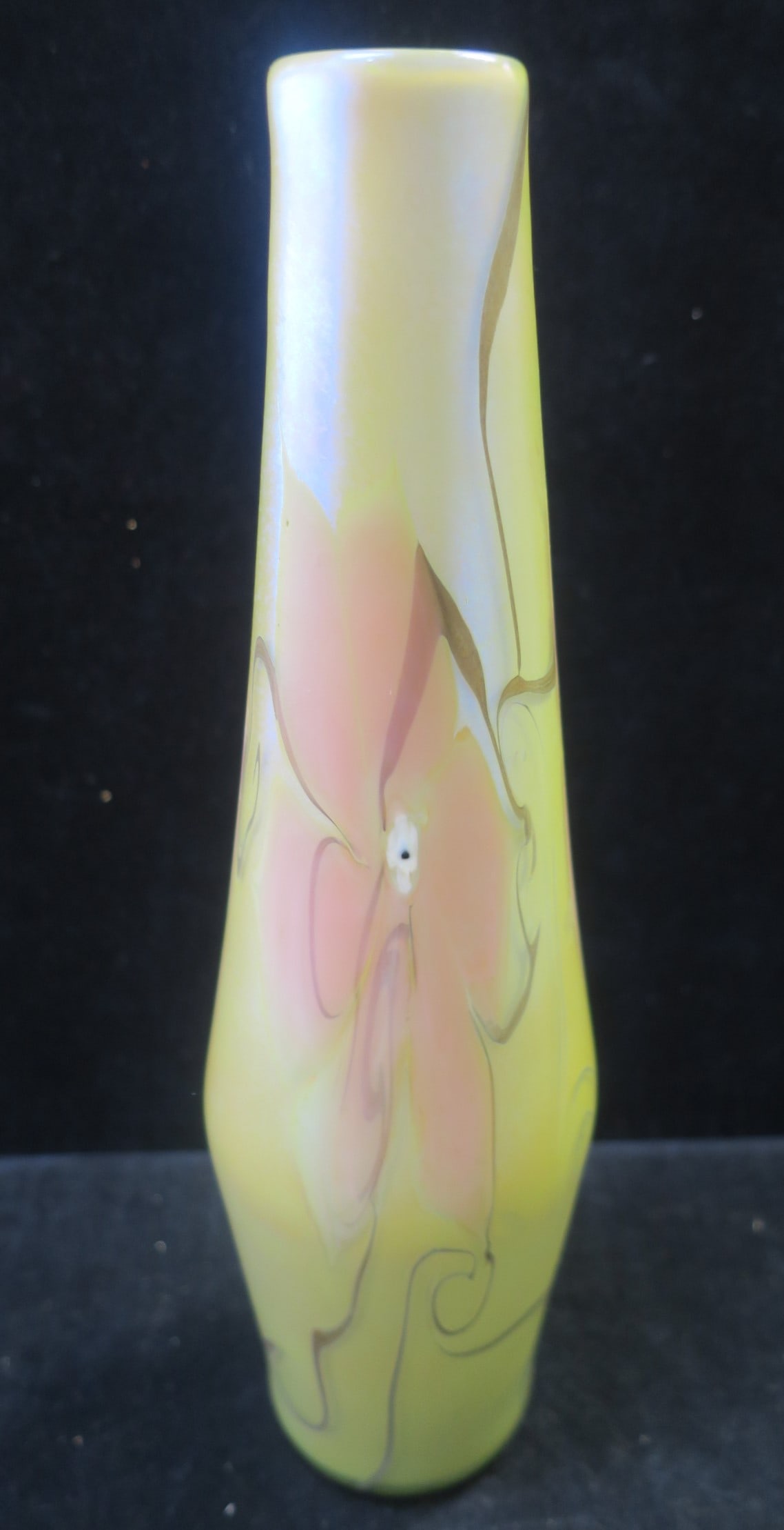 VANDERMARK Art Glass Bottle Shaped Vase:: VANDERMARK Art Glass Bottle Shaped Vase: Iridescent Gold with Pink Pulled Flowers and Green Swirls. Marked Bottom Vandermark, 2006 83. 12 1/2"T. (200-400)