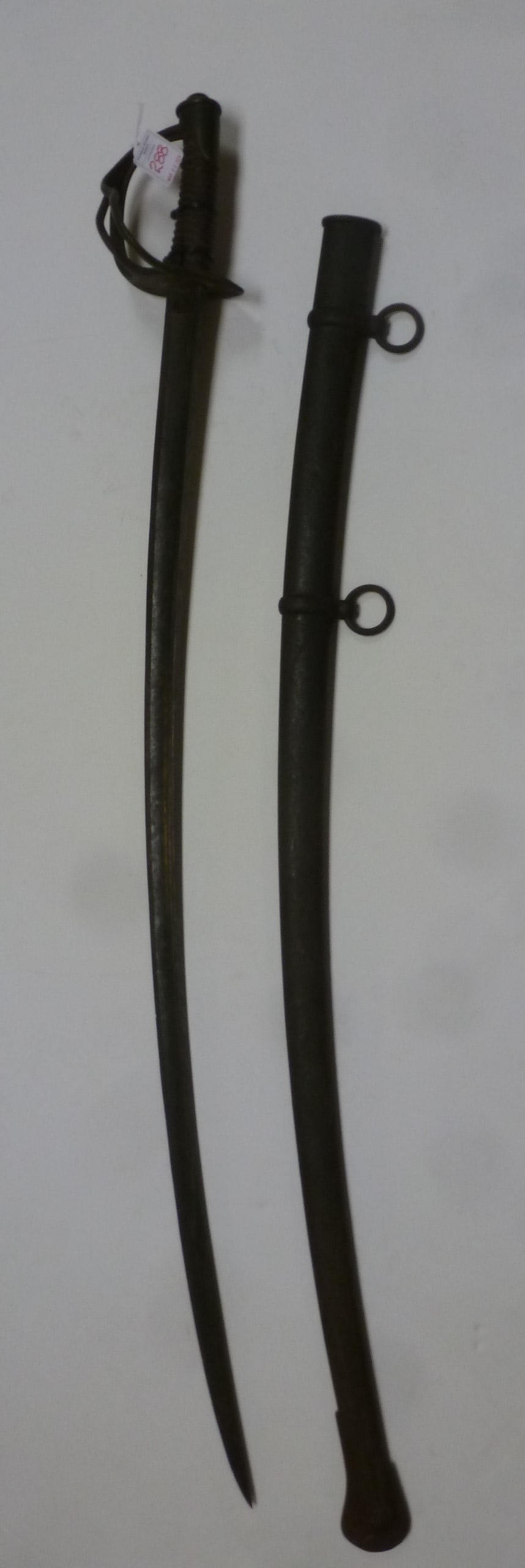 CAVALRY SABER, MODEL 1840, N.P. AMES, CABOTVILLE 1845:: CAVALRY SABER, MODEL 1840, N.P. AMES, CABOTVILLE 1845: Heavy US Cavalry Saber Nicknamed the "Wrist Breaker". Fair Condition, with Metal Scabbard with Drag and Rings. Guard is Bent with Obvious Combat 