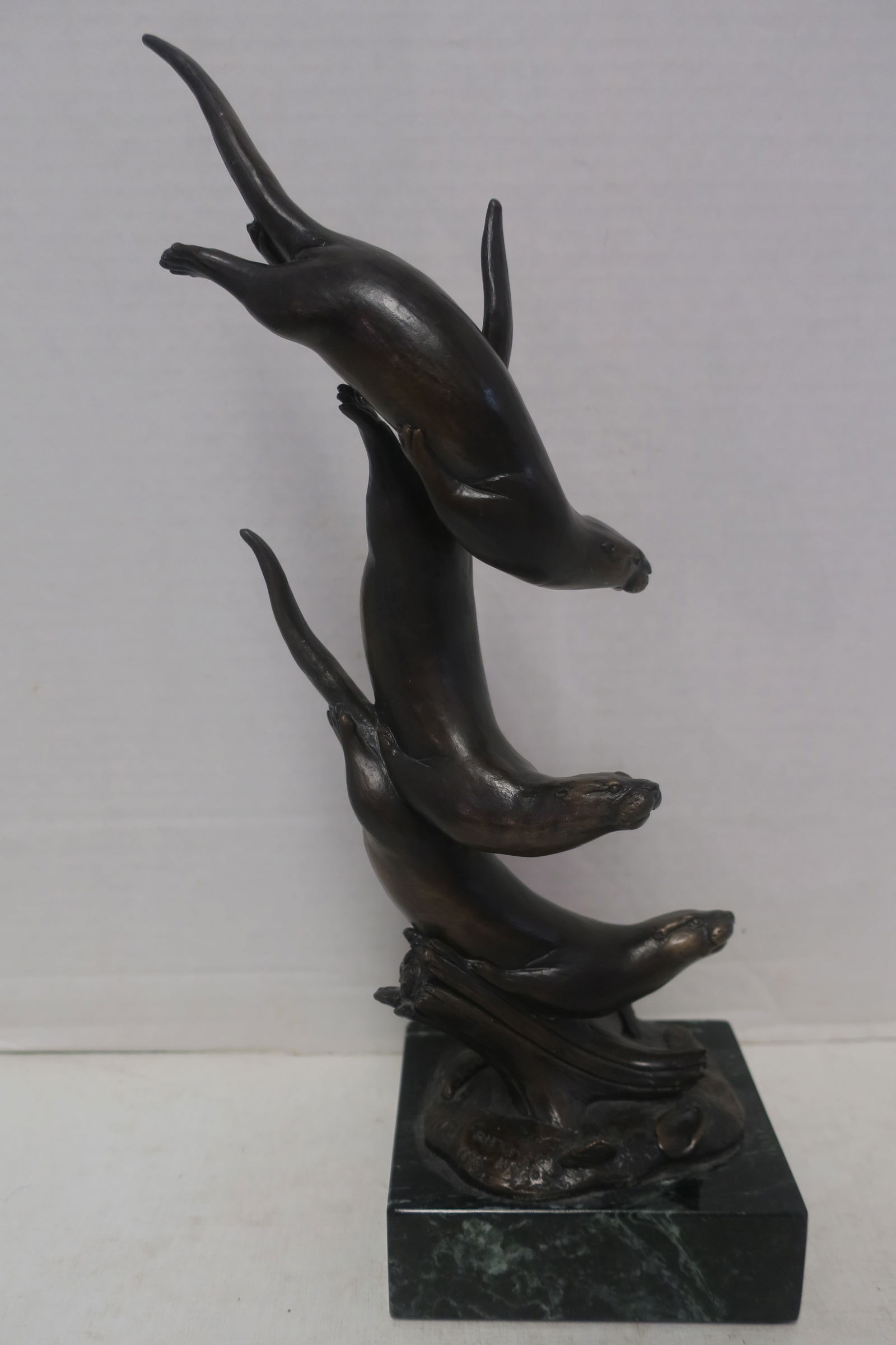 DAVID H. TURNER; THREE DIVING OTTERS, Bronze, 1996: (1 of 5)