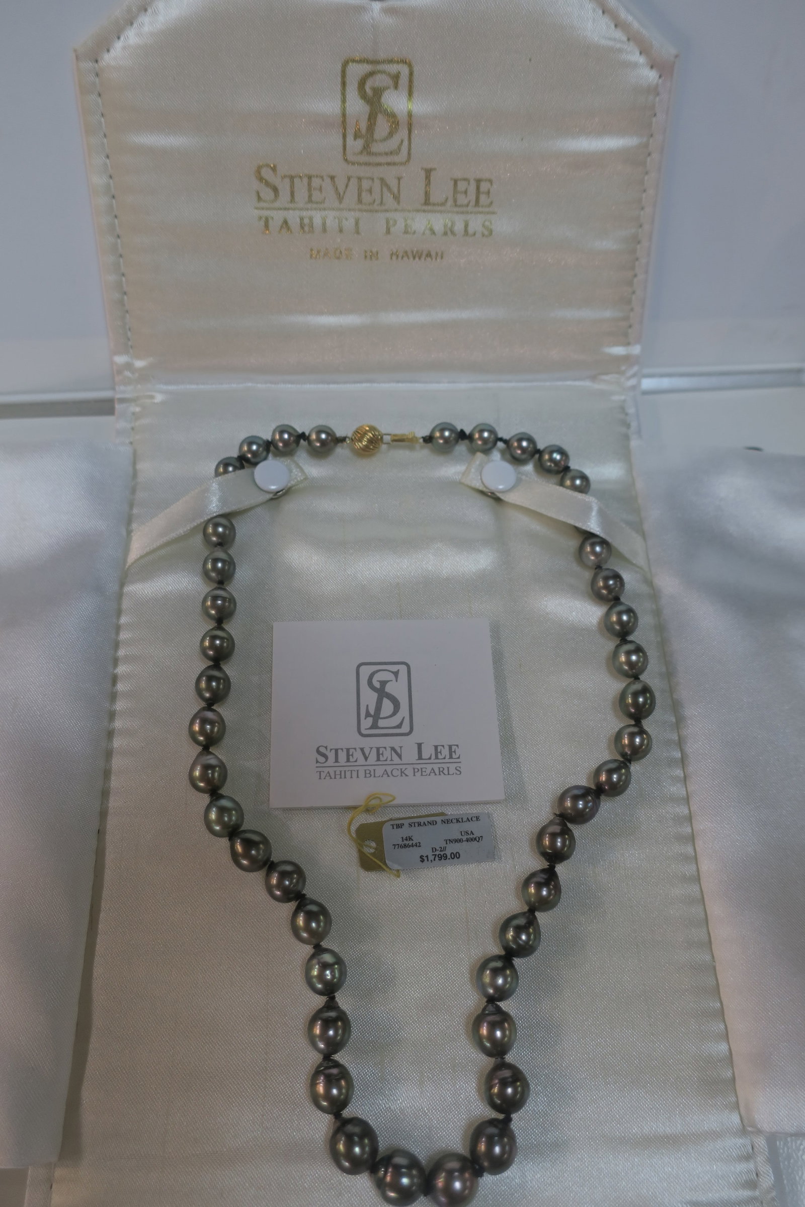 Steve Lee Design Tahiti Black Pearl Necklace:: Steve Lee Design Tahiti Black Pearl Necklace: Cultured Pearls from the Black Lip Pinctada Margaritifera Oyster. 43 Beads are Approximately 13mm, 18"L with 14KT Ball Clasp. Has COA, Original Price Tag 
