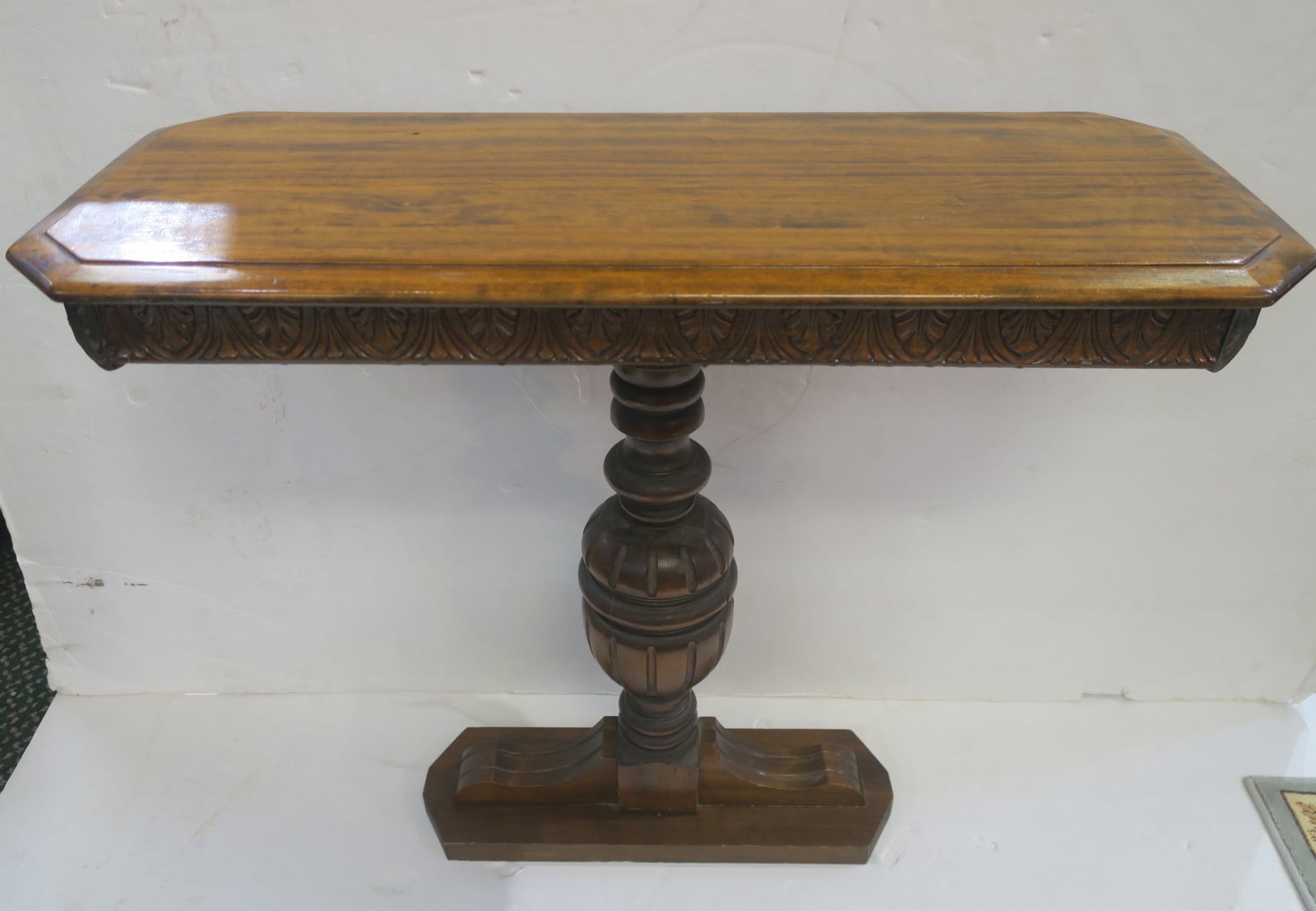Unusual Single Pedestal Sofa Table: Unusual Single Pedestal Sofa Table Beveled Rectangular Top 34" x 14" with Leaf and Line Carved Apron. Turned Baluster Single Leg Pedestal Leg with Rectangular Shoe, 29" Tall. (100-200)