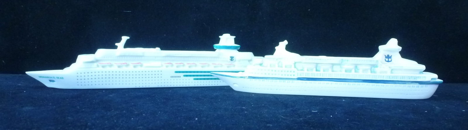 Two ROYAL CARRIBEAN LINES Ceramic Ship Statues:: Two ROYAL CARRIBEAN LINES Ceramic Ship Statues: These are Used as Decorative Centerpieces on Tables and If One Didn't Fall in Your Pocket Last Cruise Now is your Chance. 10" MONARCH OF THE SEAS and an