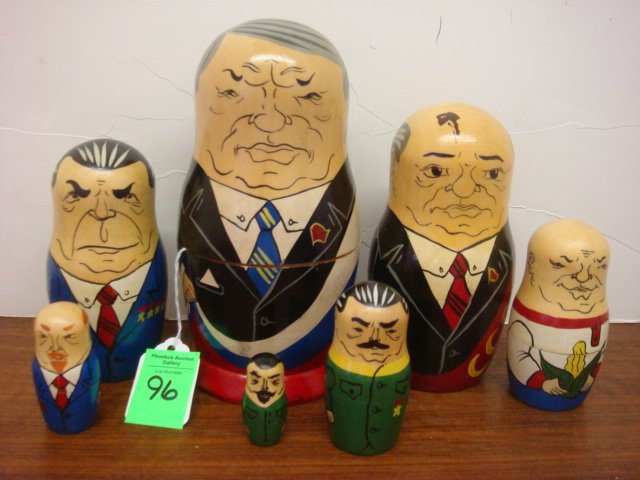 Political Matryoshka Russian Stacking Dolls, 7 Piec: Political Matryoshka Russian Stacking Dolls, 7 Piece: Each Political Leader Dressed in Different Color Suits. Ranging in Size From 6 1/2" to 2 1/2". Gorbcachev to Krushchev in Caricature. 1 Repaired.