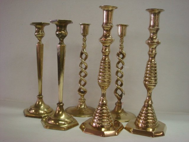 Two Pair and 1 Single Brass Candlesticks:: Two Pair and 1 Single Brass Candlesticks: Open Barley Twist on Round Foot are 11"T. Ring and Bee Hive on 8 Sided Foot with Cutaway Corners is 12"T. Tapered Hexagon Paneled on 6 Sided Base, 11"T. Some 