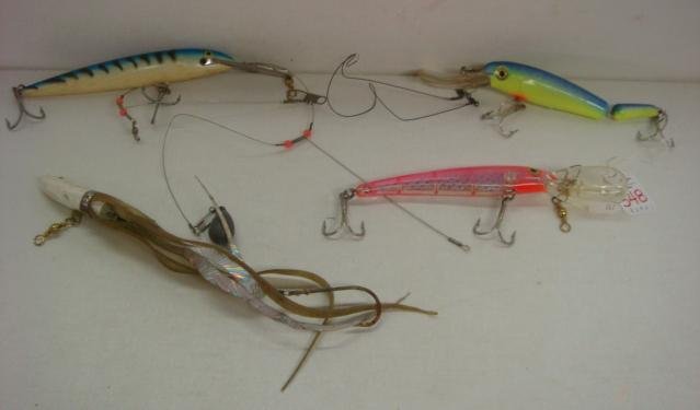 Four Fishing Lures, 1 RAPALA:: Four Fishing Lures, 1 RAPALA: Treble Hooks on Back of 3 Fresh and Salt Water. Hard Bodies, One Jointed, 3 With Oversized Swimming Lips for Diving. One Metal and Soft Fantail Lure. (40-60)