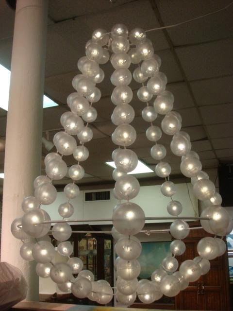 Contemporary Lighted Ball Chandelier:: 317 Contemporary Lighted Ball Chandelier: Eight Strands of 14 Lighted Plastic Balls with White 24" Metal Hoop. 33"T.