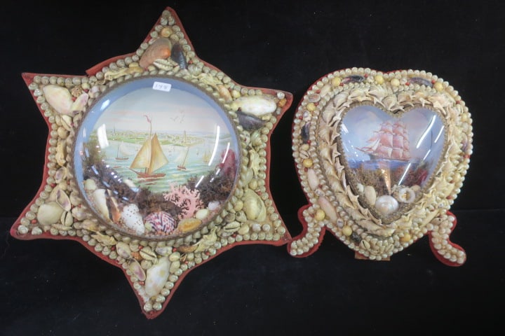 Two Vintage Sailors' Valentine Shadowbox Plaques:: Two Vintage Sailors' Valentine Shadowbox Plaques: Heart Shaped with Red Velvet Border has Convex Dome Over Shells and Seaweed. Can Hang or Stand. 8 1/2"T. 12 1/2"D Star Shaped Shadowbox Plaque has Con