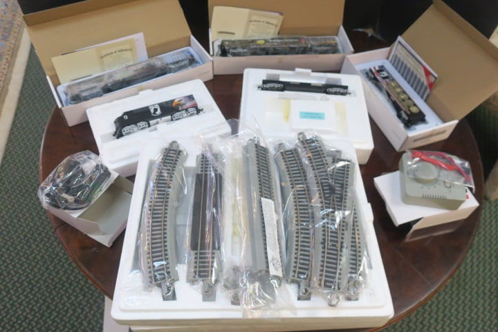 HAWTHORNE VILLAGE POW-MIA Train Set:: Included are 17 Pieces of Straight and Curved Track, Transformer and Controller. The Cars are Lost Soldier Vista Dome, Fallen Dome Car, Freedom Boxcar, Flatbed with Iwo Jima Statue and the Engine. COA