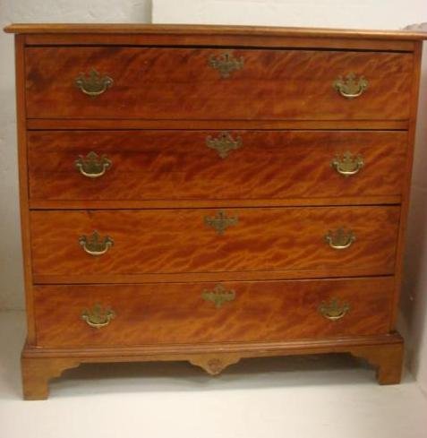 19th C. New Hampshire Mahogany 4 Drawer Chest:: 19th C. New Hampshire Mahogany 4 Drawer Chest: Beveled Top Over 4 Stacked Drawers. Brass Hardware with Brass Batwing Escutcheons and Bail Handle. Raised on Bracket Feet. 42"W X 18"D X 39"T. (500-800)