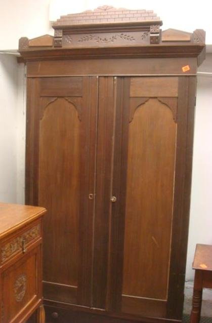 Late Victorian Eastlake Substyle Walnut Armoire:: Late Victorian Eastlake Substyle Walnut Armoire: Cornice with Spoon and Line Carved Crown over Double Door Cabinet. Inside has one side with Three Shelves, Other Side is Open Space with one top shelf.