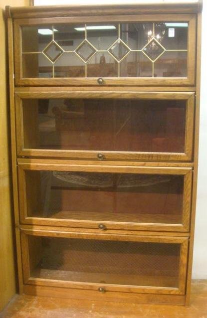 Barrister's Style Oak Bookcase:: Barrister's Style Oak Bookcase: Four Lift Front Glazed Doors, One with Beveled Glasses and Cames. Copper Knobs. American, CA 1910-1920. (-)