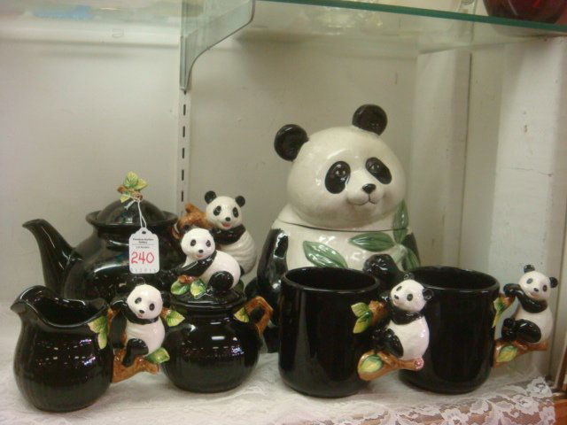 Panda Cookie Jar and 5 Piece Tea Set: Panda Cookie Jar and 5 Piece Tea Set: Omnibus Ceramic Panda with Bamboo Cookie Jar is 10"T. Vendor Panda Tea Set Includes 7"T Teapot, 5 1/2"T Sugar, 4"T Creamer and Two 4 1/2"T Mugs. (80-120)