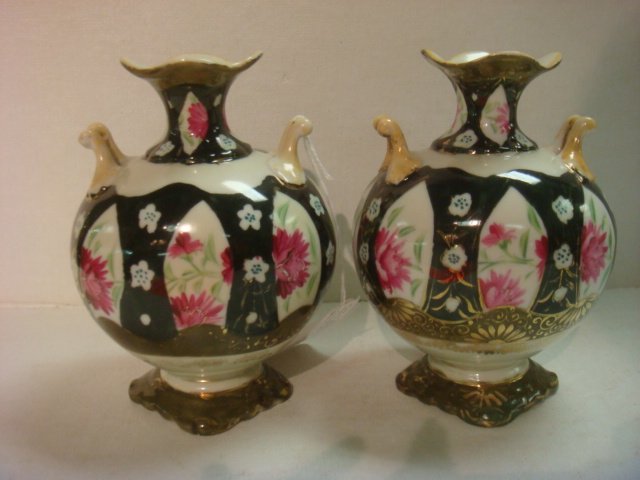 Pair of Nippon Porcelain Handpainted Footed Vases:: Pair of Nippon Porcelain Handpainted Footed Vases: Double Handled. Unmarked. 7"T. One has Hairline Fracture. (30-50)