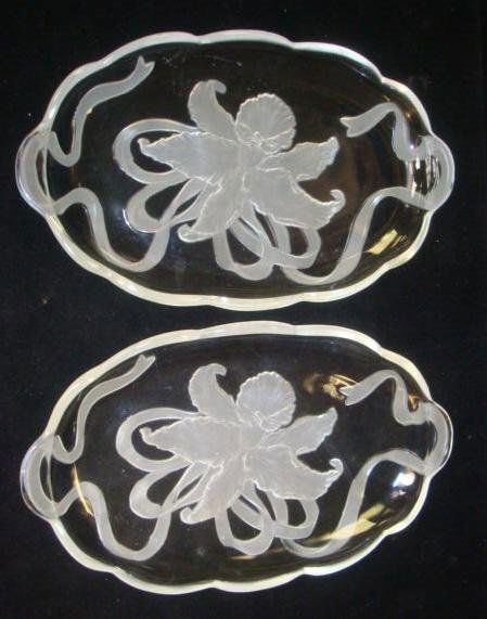 Pair of Intaglio Cut Glass Trays: Pair of Intaglio Cut Glass Trays: Each 14" Oval Tray has a Frosted Orchid and Ribbon on the Bottom. Tab Handles. Some Light Scratches (40-60)