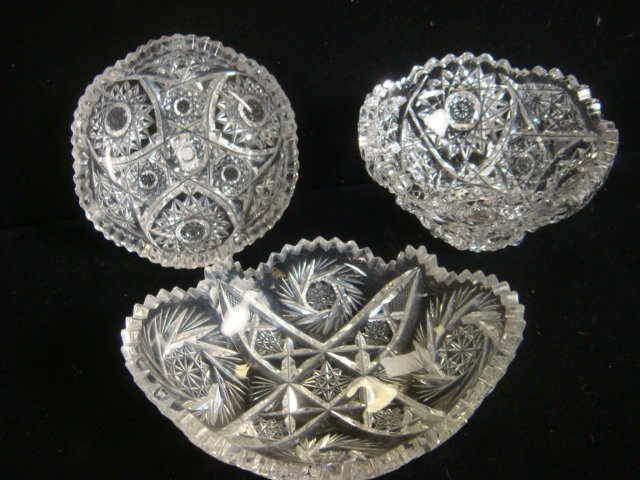 Three cut Crystal Bowls:: Three cut Crystal Bowls: Mayonnaise Bowl is 3"T, 5 1/4"D. High Point Chip. Oval Bowl is 2"T, 6 3/4"D. Shallow Bowl is 1 1/4"T, 5"D. (40-60)