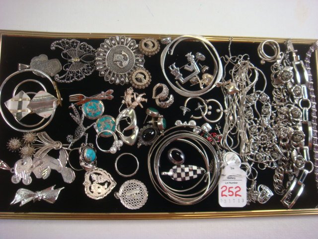Ladies Silvertone Costume Jewelry:: Ladies Silvertone Costume Jewelry: Bracelets, Necklaces and Earrings. 6 Bangle and 2 Cuff Bracelets. Road Runner, Mickey, Heart and Floral Pins. Clip and Pierced Earrings. Nefertiti Pin and Earrings, 
