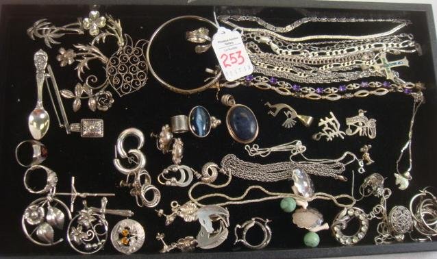 Collection of Sterling Silver Jewelry:: Collection of Sterling Silver Jewelry: Bracelets with Tanzanite, Amethyst and Charms. Clip and Pierced Earrings, Lapel Pins, Necklace Slides and Indian Earrings. Marcasite Pendant, Hoop Earrings and C