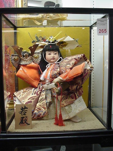 oriental dolls in glass cases