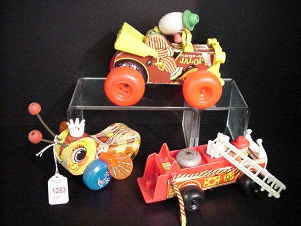 6 Fisher Price Pull Toys: 6 Fisher Price Pull Toys: Clowns, Bugs, Fire Engines.