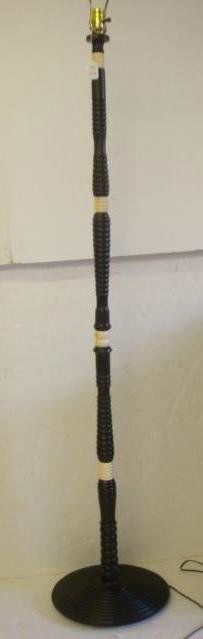 Carved African Ebony & Ivory Floor Lamp:: Carved African Ebony & Ivory Floor Lamp: Section of Ebony Wood and Carved Ivory Connectors Form This 62 Inch Tall Floor Lamp. Brought Home in the 1950's By a Merchant Marine Sailor. (300-600)