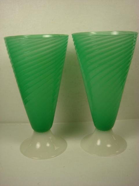 Pair of Signed STEUBEN Jade Green Swirl Vases:: Pair of Signed STEUBEN Jade Green Swirl Vases: Jade Green Swirled Cone Shaped Vases with Alabaster Foot. Steuben Fleur-Di-Lis Acid Etched Mark On Applied Foot. 12"T. (600-1000)