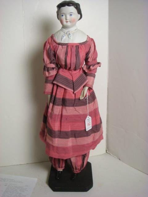 1890's German 20" Molded Parian China Head Doll:: 1890's German 20" Molded Parian China Head Doll: Bisque Shoulder Head, Arms and Legs with Cloth Body. 3 Sew Holes Front and BackPainted Facial Features, Stitch Jointed. Molded Highlighted Blouse with 