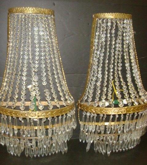 Pair of Princess Style Crystal Beaded Sconces:: Pair of Princess Style Crystal Beaded Sconces: Each with Interior Light within 12 Ropes of Vertical Clear Beads. Three Tiered Frame Below Hung with Spear Prisms. 24"T X 13"W. (320-600)