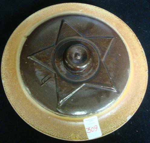 Four Gallon Stoneware Crock Lid, Possibly Red Wing:: Four Gallon Stoneware Crock Lid, Possibly Red Wing: Lid has Brown Glazed Center with Raised Star and Knob. 11 1/2"D. Fits 9 1/2" Opening. (60-80)