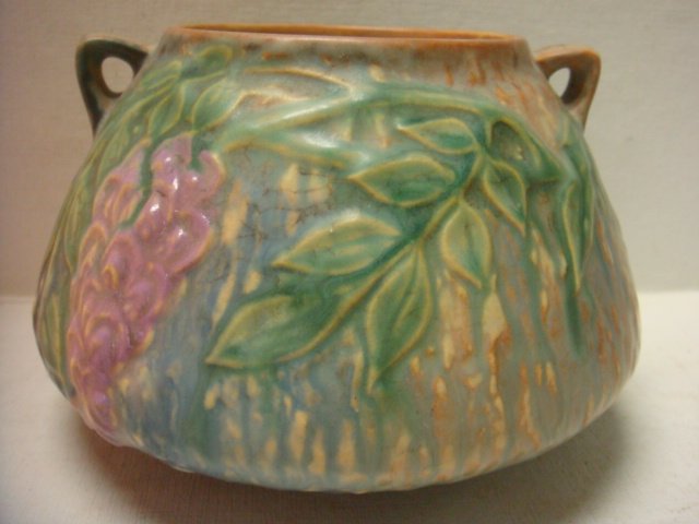 1933 ROSEVILLE Wisteria Double Handled Vase:: 1933 ROSEVILLE Wisteria Double Handled Vase: Gloss and Matte Glaze. Squat Shape. Mottled Ground with Orchid Flower Among Foliage. Model #629-4. 4"T, 7"W. (200-300)