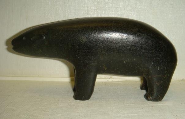 Hand carved Inuit Stone Polar Bear:: Hand carved Inuit Stone Polar Bear: Eskimo Considers Bears a Rival which Hunts for the Same Food. Aggressive, Carnivorous and Great Hunter. Standing Bear is 5 3/4"L X 2 1/2"T. Defined Head and Tail Fe
