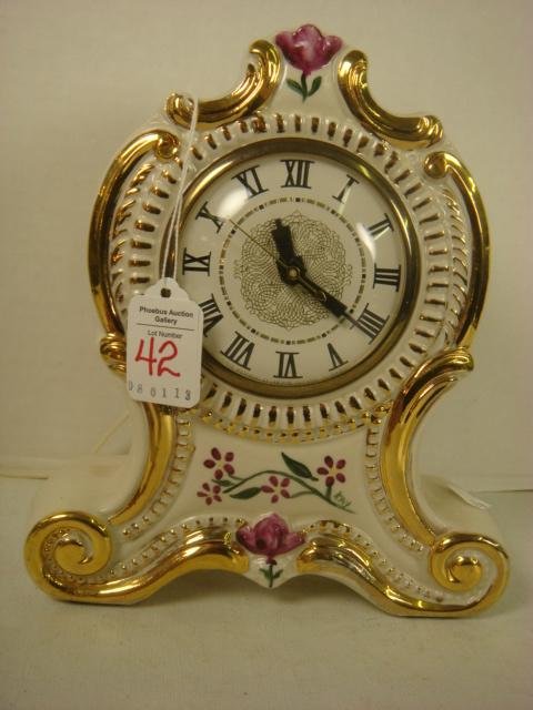 Vintage LANSHIRE Porcelain Electric Clock:: Vintage LANSHIRE Porcelain Electric Clock: Handpainted with Gold Trim, Roman Numerals with Convex Glass Face. Porcelain Case has Tulip Design. Time Set with Knob on Back. Made in Holland. 8 1/2"T. (50