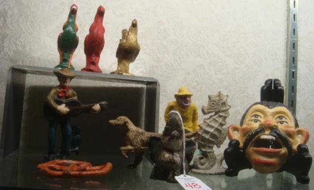 Ten Cast Iron Bottle Openers, Original and Repro:: Ten Cast Iron Bottle Openers, Original and Repro: Includes 4 3/4" Guitar Playing Cowboy, 4 1/4" Fisherman, 4 1/4" Seahorse, 3 1/8" Sitting Elephant, 4 1/2"L Setter, 3"D Pretzel, 4"T 4 Eyed Man, Two 3 