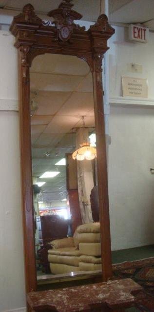 C 1880 Eastlake Walnut Pier Mirror w/Marble Top Stand:: C 1880 Eastlake Walnut Pier Mirror w/Marble Top Stand: Carved Mirror Frame Enclosing Mirror with Molded and Incised Cornice, Masks at Corners. Carved Dolphins at Base. Carved Stepped Bench with Confor