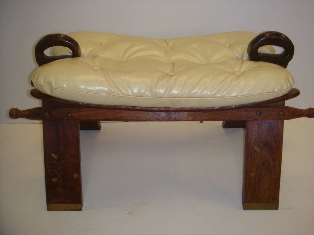 Egyptian Camel Saddle Stool:: Egyptian Camel Saddle Stool: Double Handle with V Shaped Wooden Frame. Fitted Button Tufted Cushion. Solid Construction, No Cracking. Brass Inlaid Accents on Legs and Handles. 16"T X 30"W X 13"D. (40-