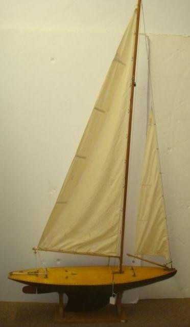 Early 20th Century "POND SAILER" Model:: Early 20th Century "POND SAILER" Model: Carved Hull and Planked Deck, with Hardware. Ready to take out to the Reflecting Pool and Sail Across. With Stand. Very Good Condition. 36" Long, 68" Tall 8" Wi