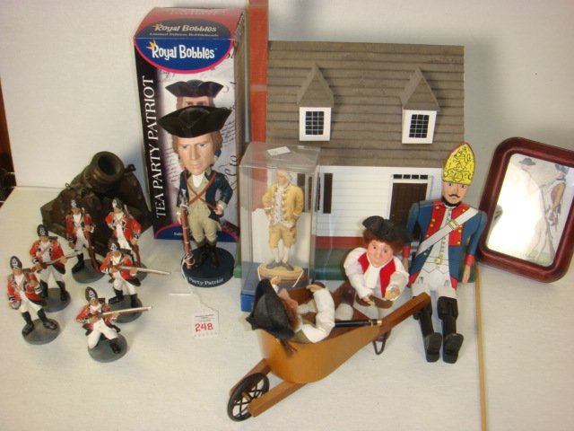 Collection of Williamsburg Related Figurines:: Collection of Williamsburg Related Figurines: Tea Party Patriot Bobble head, Lord Dunmore, 6 British Grenadiers, Hessian Grenadier Stick Puppet, Cannon, "Early Bird" Bird House by A. Michael Radcliffe