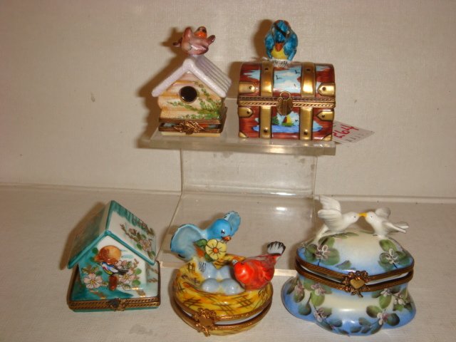 Five Bird Theme Hand Painted Limoges Boxes:: Five Bird Theme Hand Painted Limoges Boxes: Parrot on Treasure Chest, 2 5/8"T, Love Doves on lid, 2 1/2"T, Birds on Nest, 2", Birdhouse with 2 Birds, 2 1/2"T, Bird House, 2"T. (250-350)