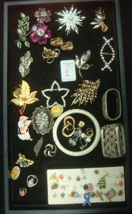 Ladies Costume Jewelry Pins and Earrings:: Ladies Costume Jewelry Pins and Earrings: Avon Starburst Pin, Napier Earrings, Assorted Pierced Stud Earrings, Rhinestone Pins and Buckle, Variety of Lapel Pins. 2 Napkin Rings and Faux Bone Carved
